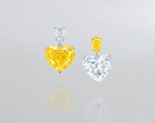 12.35 carat Heart Shape Fancy Vivid Yellow and White Diamond Earrings
