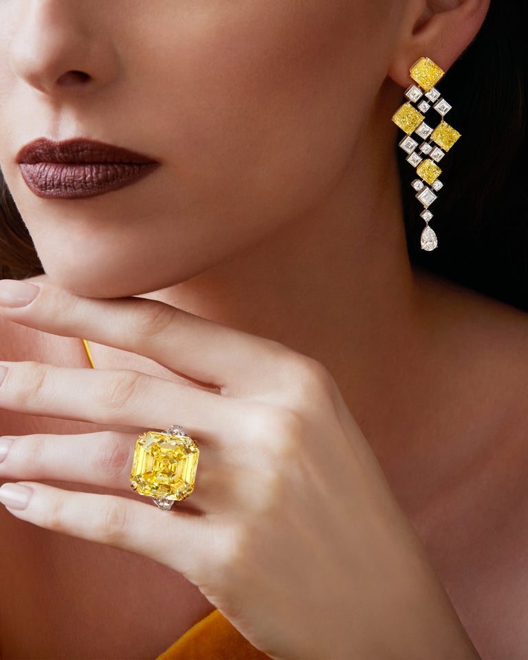 Sold at Auction: FANCY INTENSE YELLOW DIAMOND AND DIAMOND RING