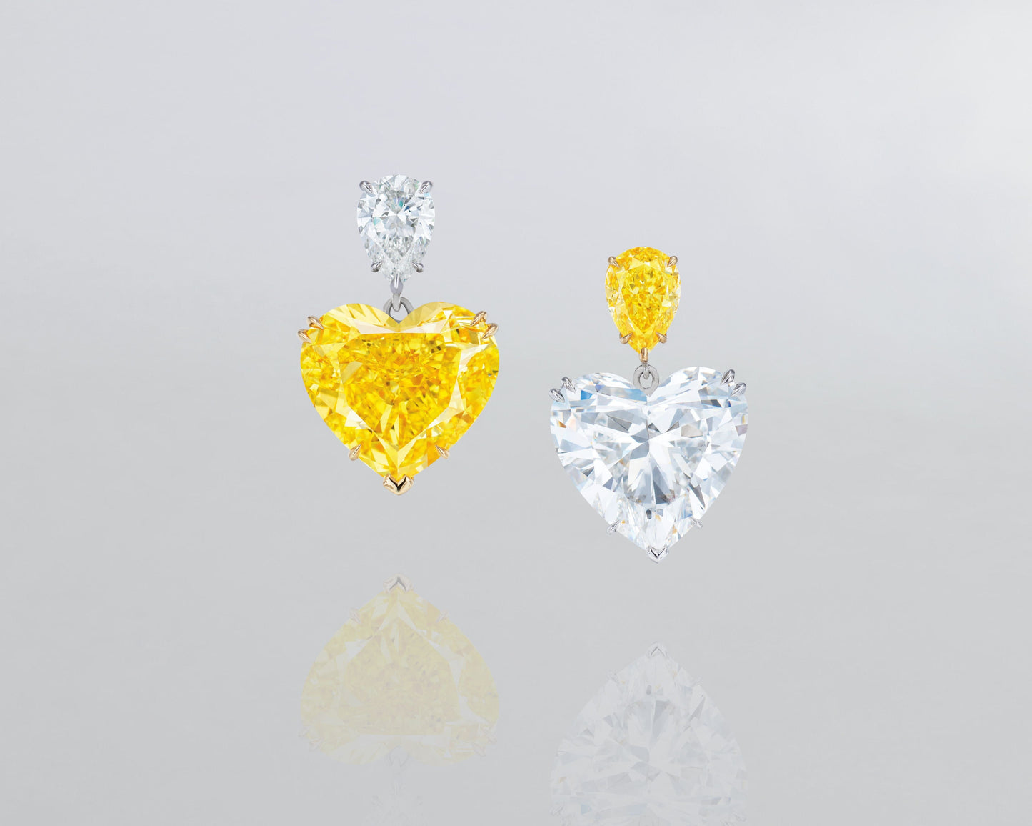 12.35 carat Heart Shape Fancy Vivid Yellow and White Diamond Earrings