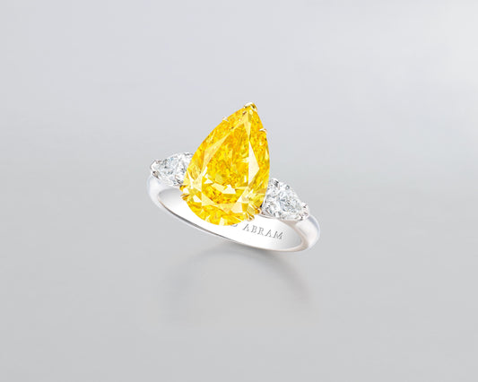 3.63 carat Pear Shape Fancy Vivid Orange Yellow Diamond Ring